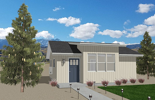 Holiday-Main-Image-520x335 A small beige ADU with a dark gray door and roof sits in a landscaped yard with shrubs, gravel, and two tall pine trees. Mountains and a blue sky with clouds are visible in the background.