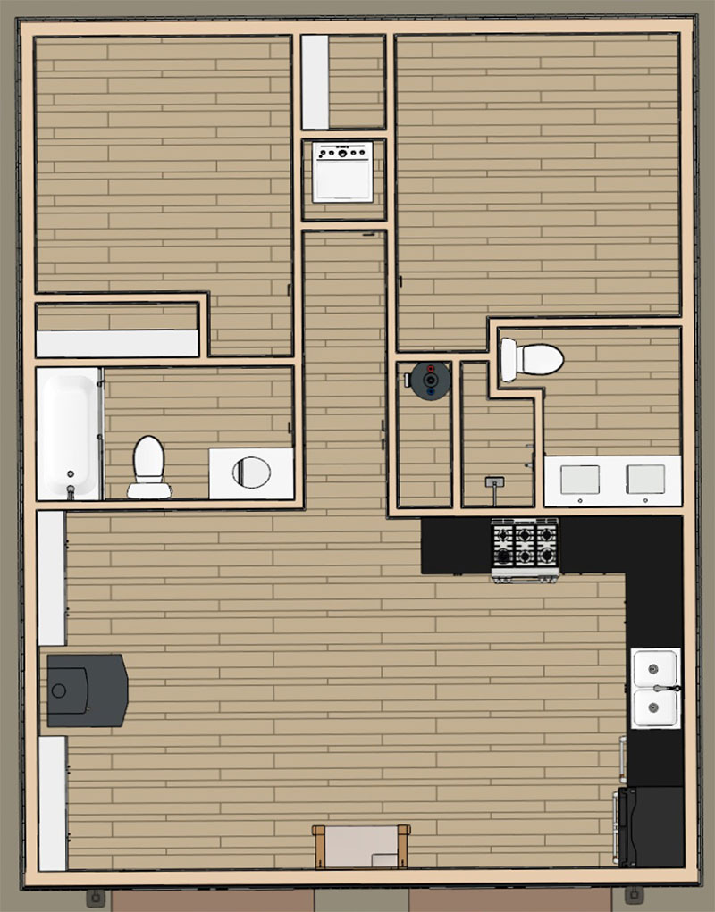 Icarus-ADU-Dollhouse-01 Floor plan of a one-bedroom ADU with a kitchen, living area, bathroom with bathtub, two toilets, stove, sink, and appliances, all shown with wooden flooring and simple furnishings.